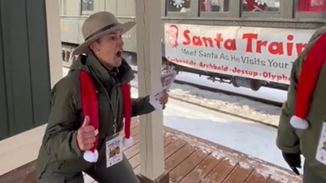A ranger on a train platform