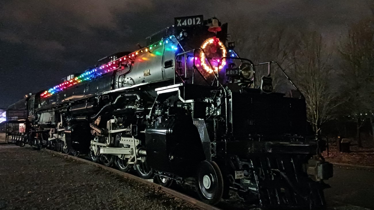 Big Boy Locomotive at night decorated with colorful Christmas lights