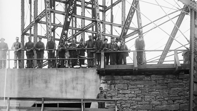 Miners receiving safety lamps