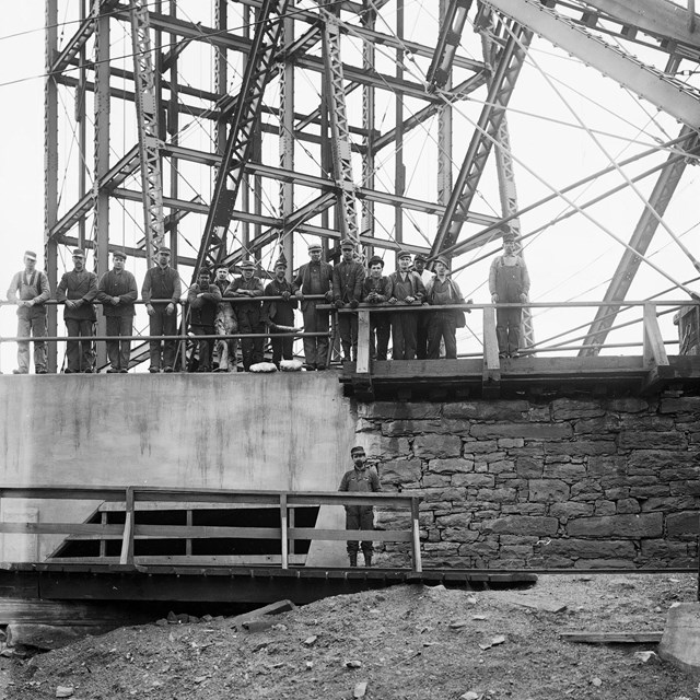Miners receiving safety lamps