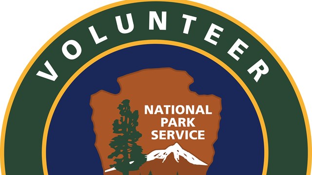 National Park arrowhead with green banner circling it with volunteer inside.