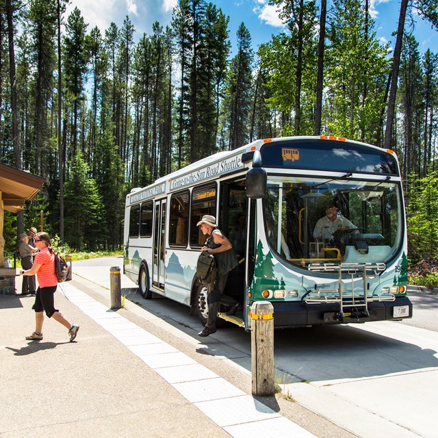a person disembarks a bus that reads 