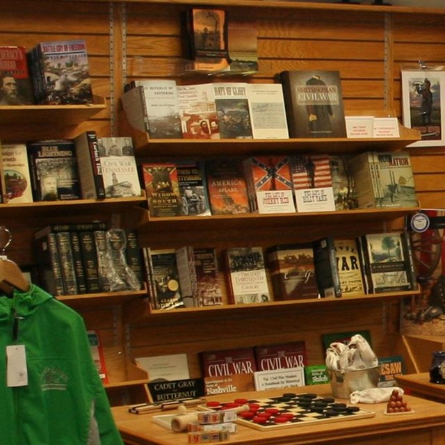 Inside a gift shop, with Civil War shirts, books, and toys for sale.