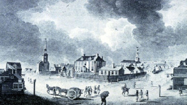 An engraving of an old town with brick buildings, horse-drawn carts, and people walking around.
