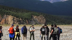 Group of people at a national park with mountains in background