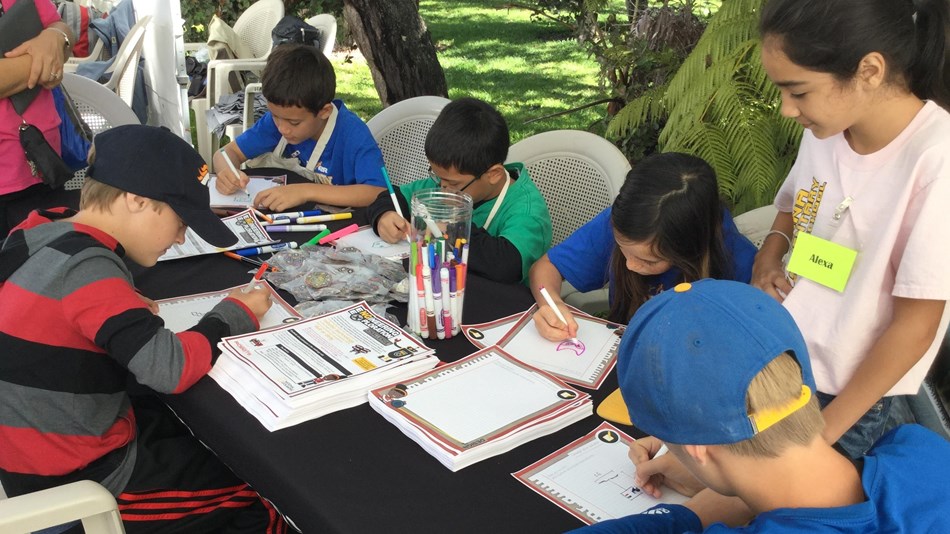 Kids sitting and coloring