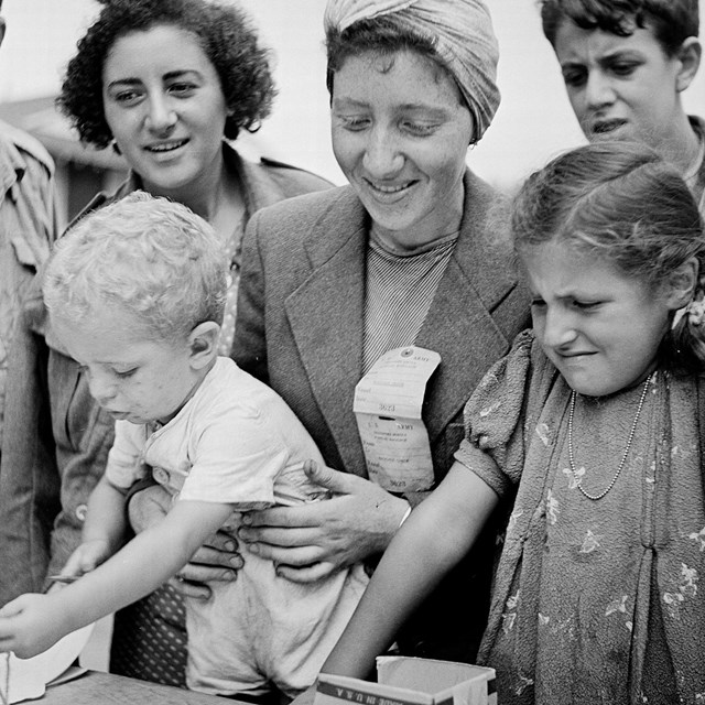 Women and children registering for the Fort Ontario Refugee Camp, August 1944
