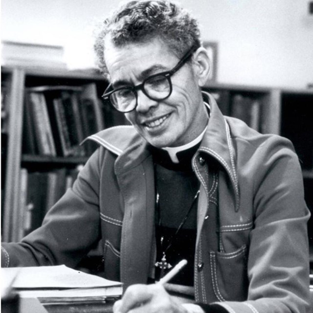 Pauli Murray studying in a library. UNC Chapel Hill Collections.