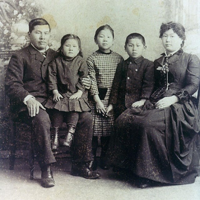 Asian American family sitting for a portrait
