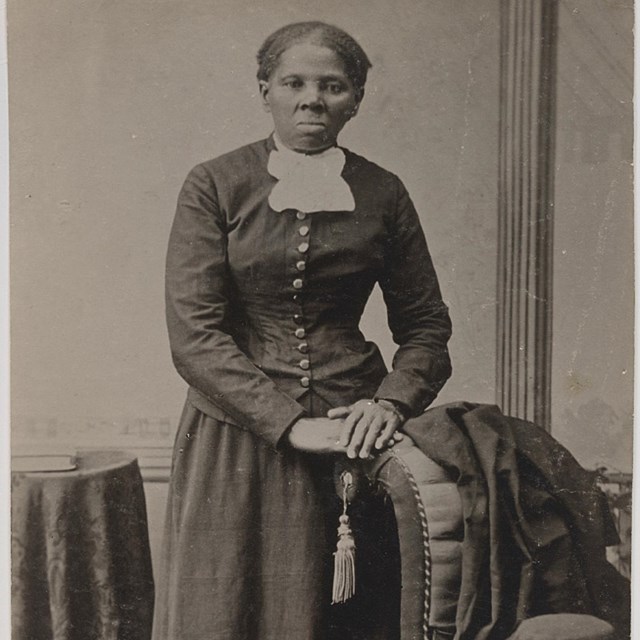 Portrait of African American woman in black dress