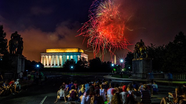 Visitors watch fireworks celebrating the Fourth of July at the Lincoln Memorial 