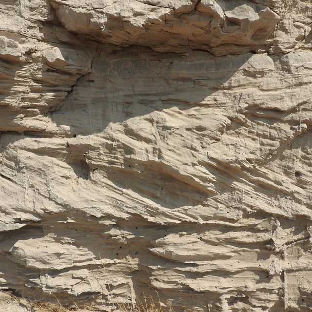 Different angled layers of stratified sandstone. 