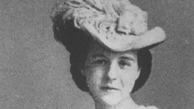 A black and white image of Mittie Bulloch Roosevelt wearing a hat and looking at the camera.