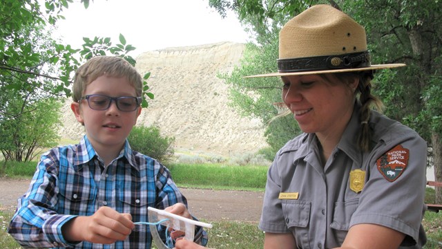 Ranger with child at table