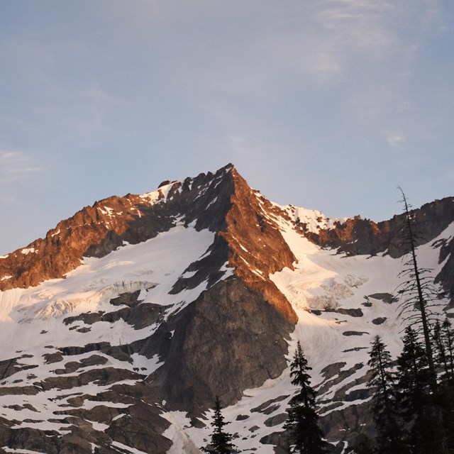 A landscape photo of a snowy mountain