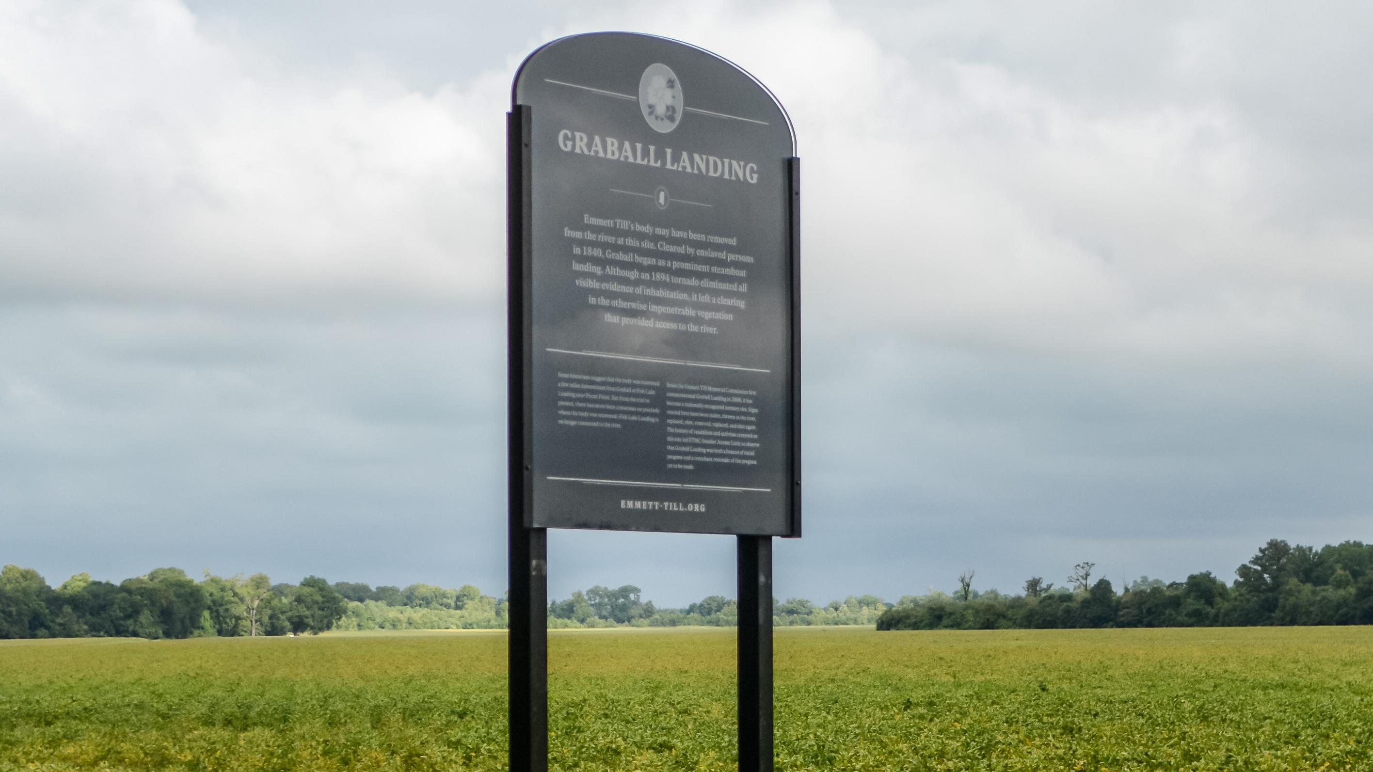 Historic marker with corn fields in the background