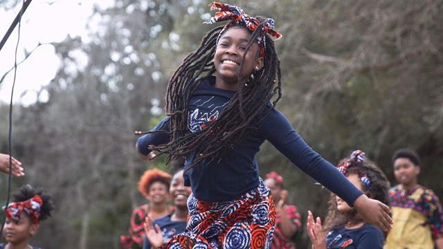 dancer in costume smiles