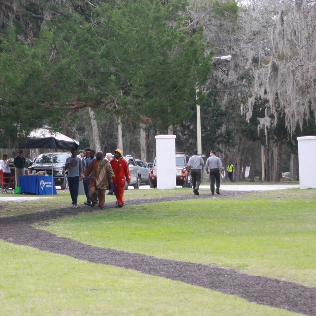 people walking on bonded mulch trail 