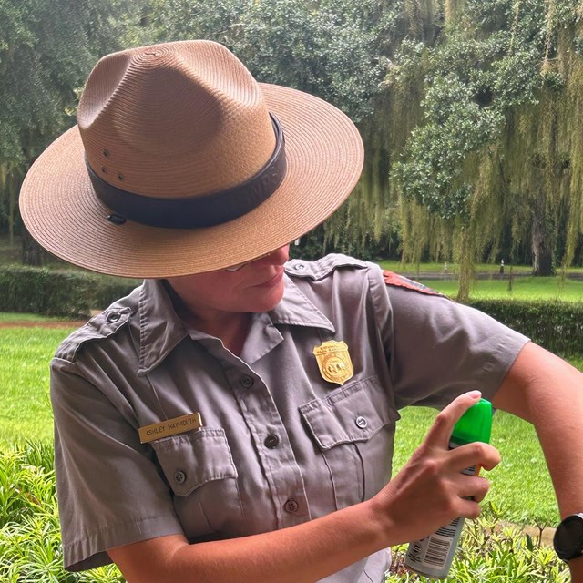 ranger puts on bug spray 