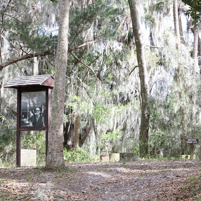 former cabin site of willie browne, with sign and representative doorway 