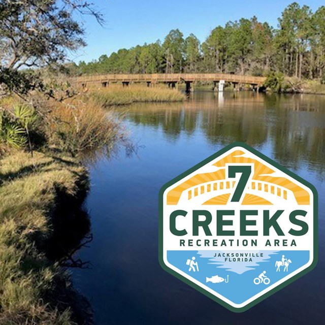 blue rive and a bridge with 7 creeks logo