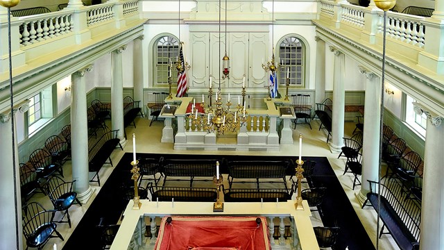 A two-story rectangular worship space.
