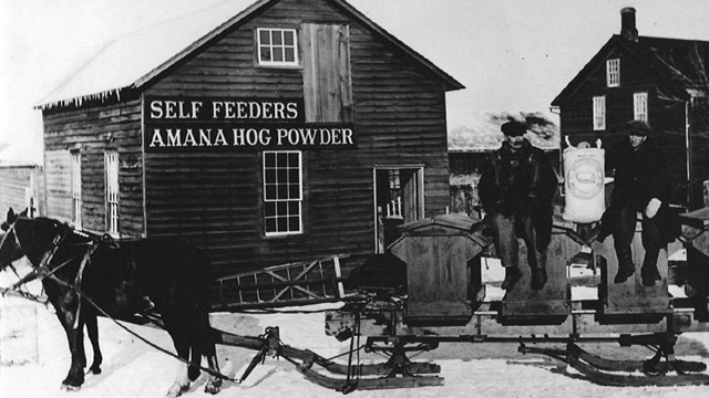 men and horses lined up outside the powder house