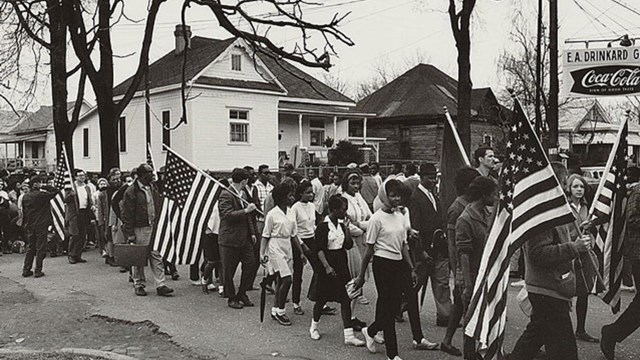 marchers with American flags