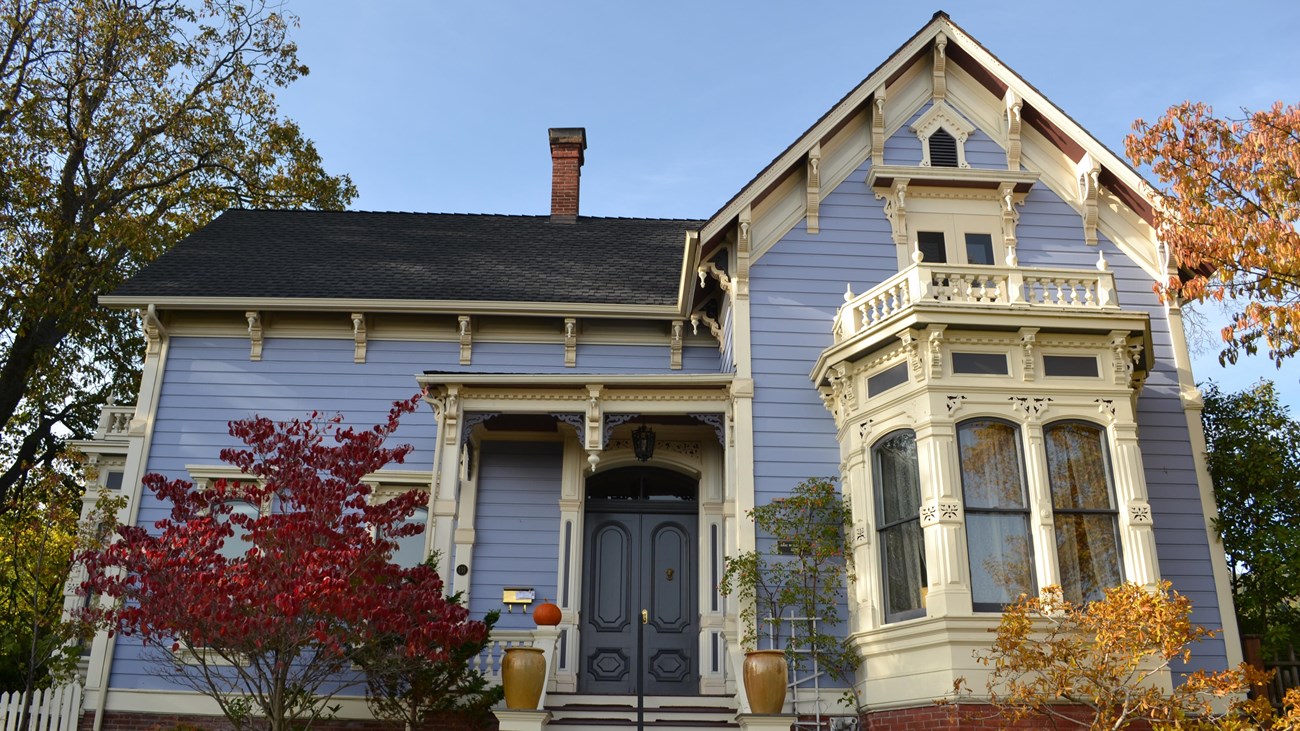 Photo of historic house with lattice. 