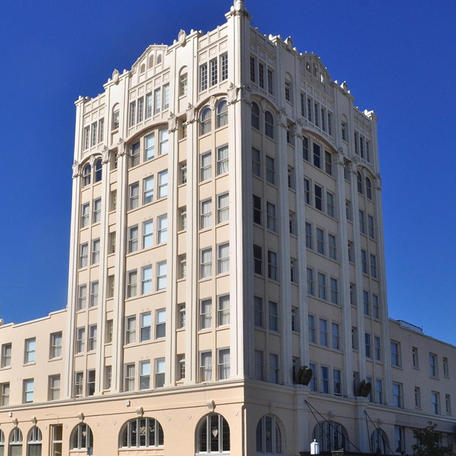 Photo of tall art deco building. 