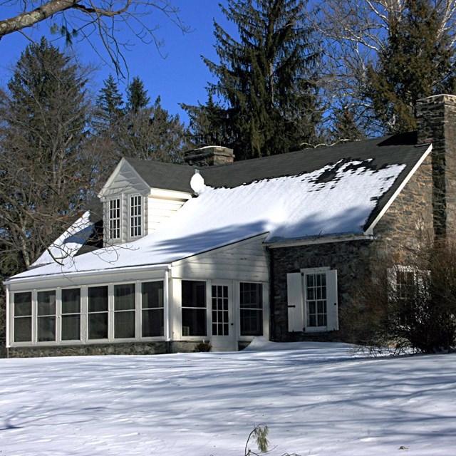 Photo of snow-covered house. 