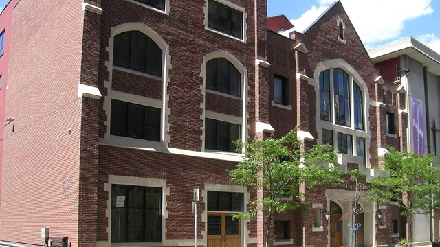 Photo of large brick church. 