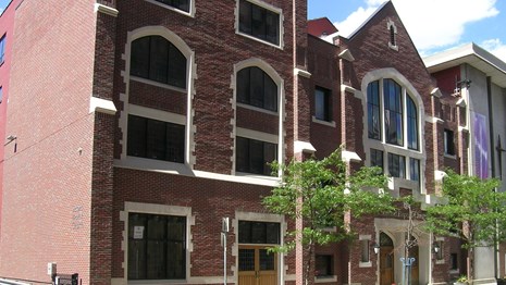Photo of large brick church.