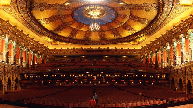Interior of an ornate theatre. 