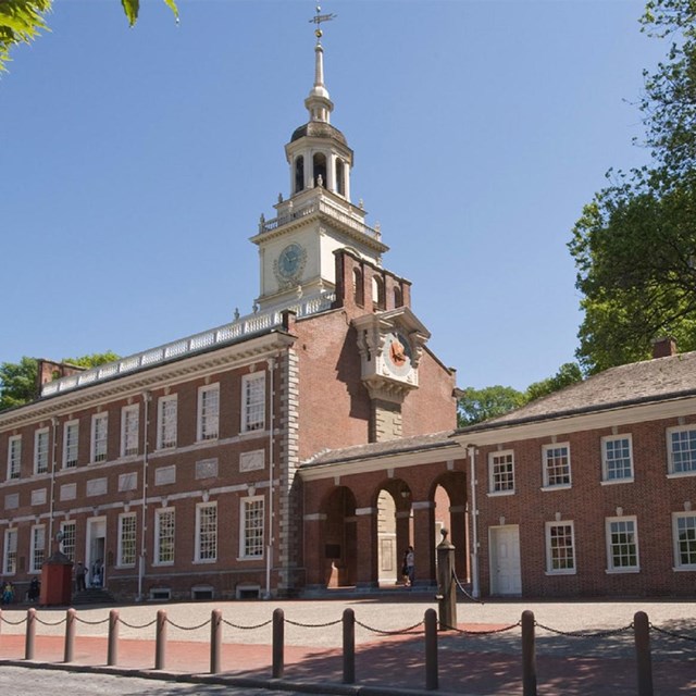 Photo of large brick building with bell tower.  NPS photo. 