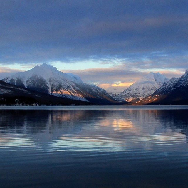 Photo of snow covered mountain and lake. CC0