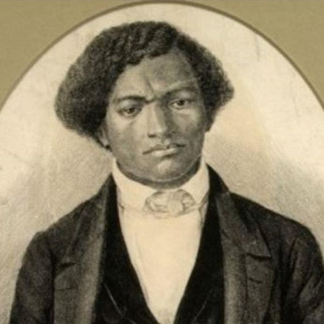 Photo of man sitting. 