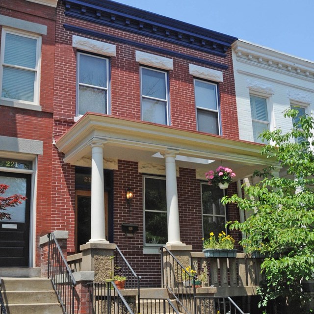Photo of a brick row-house. 