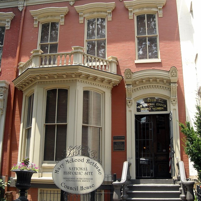 Photo of exterior of brick house. 