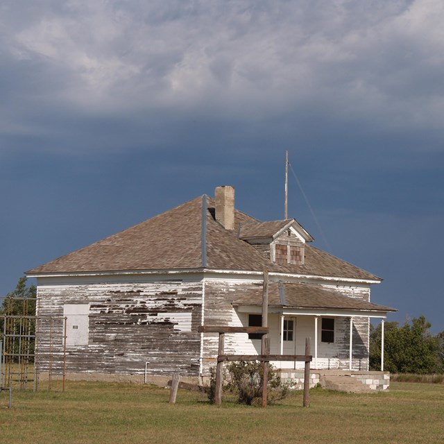 Dilapidated house with water tower. NPS photo. 