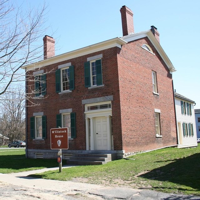 Two-story brick house. 