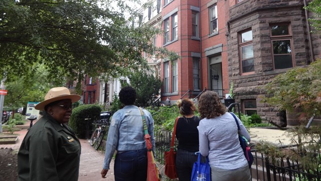 NPS ranger leading a group of women on a neighborhood tour. CC0