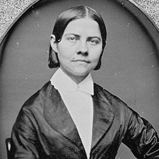 Photo of woman in picture frame. 