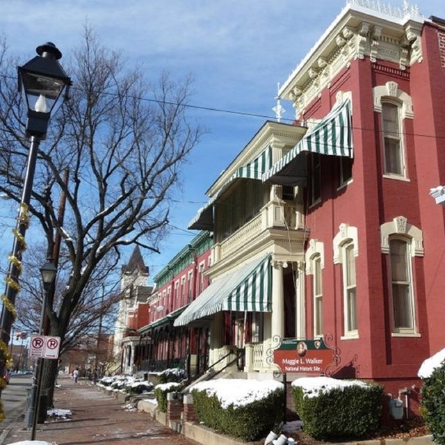 View of front of two-and-a half story Maggie Walker house, made of brick. Courtesy NPS. 