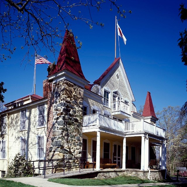 Two and a half story home with pointed red roofs.  Carol Highsmith Collection, Library of Congress.