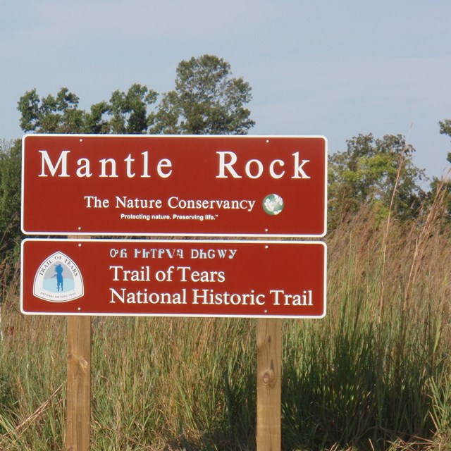 A large brown sign that reads 