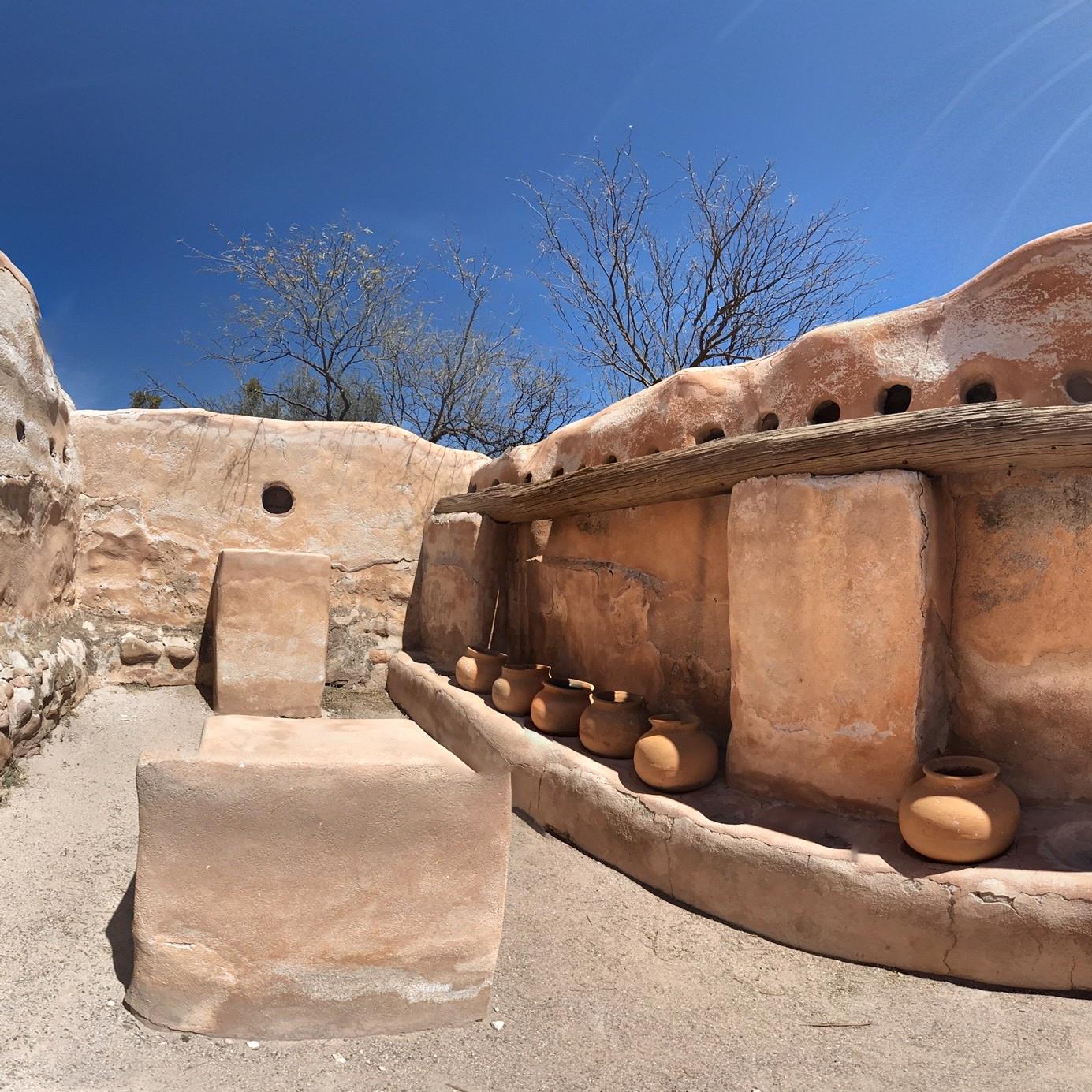 spherical panoramic photo of storeroom with pots
