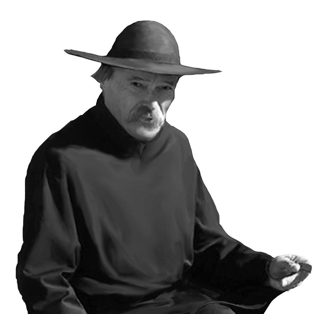 mustached man in black robes and hat