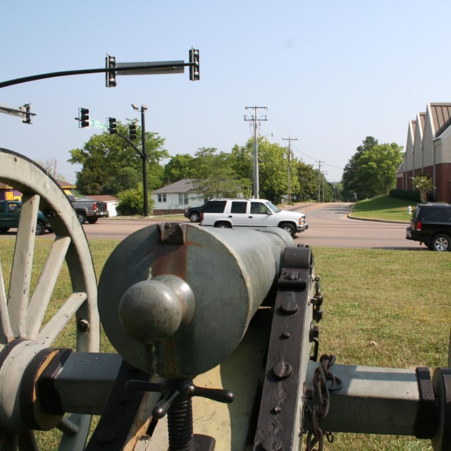 A canon pointing across the road.