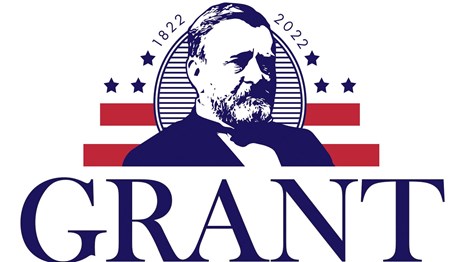 Red, white, and blue graphic of bearded man wearing suit and bowtie.